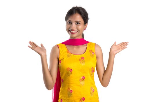 Beautiful Indian traditional girl posing on white background.