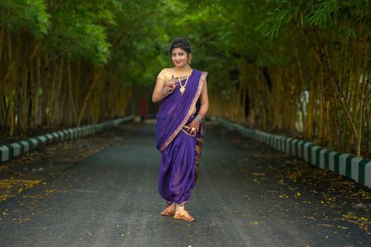 Indian Traditional Beautiful young girl in saree posing outdoors