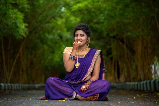 Indian Traditional Beautiful young girl in saree posing outdoors