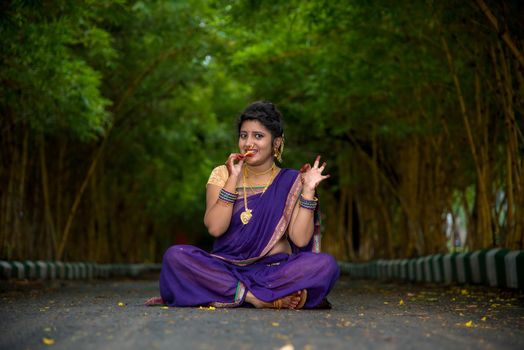 Indian Traditional Beautiful young girl in saree posing outdoors