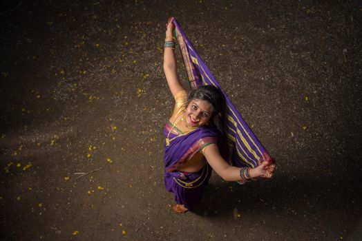 Indian Traditional Beautiful young girl in saree posing outdoors