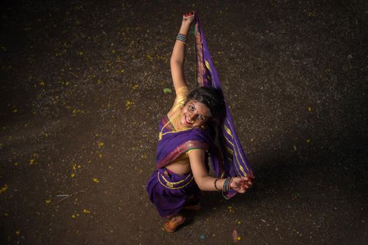 Indian Traditional Beautiful young girl in saree posing outdoors