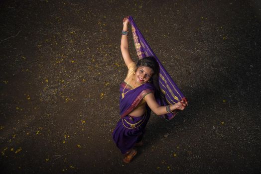 Indian Traditional Beautiful young girl in saree posing outdoors