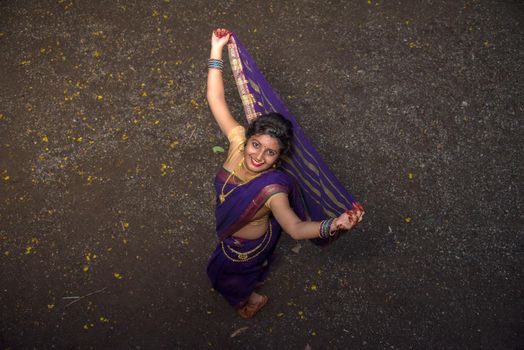 Indian Traditional Beautiful young girl in saree posing outdoors