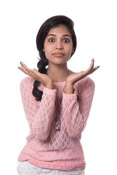 Beautiful young girl posing on white background.