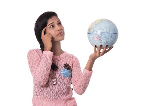 Beautiful Girl holding a world globe isolated on a white background