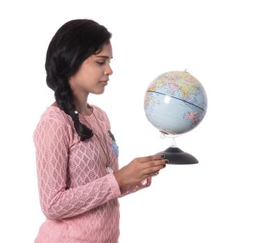 Beautiful Girl holding a world globe isolated on a white background