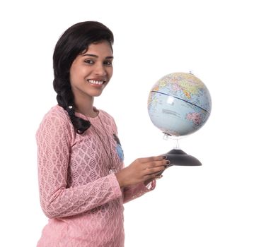 Beautiful Girl holding a world globe isolated on a white background