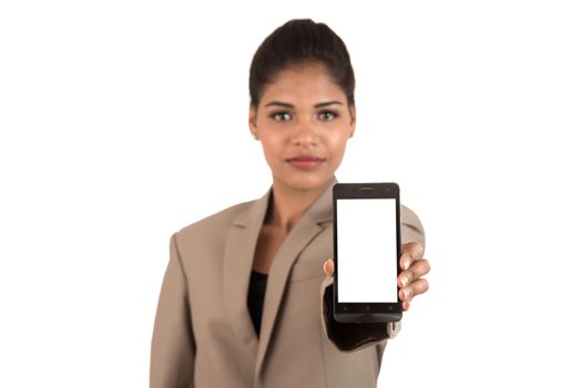 Young beautiful woman holding blank screen smart phone on white background