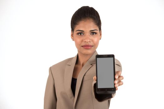 Young beautiful woman holding blank screen smart phone on white background