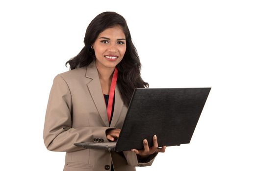 Young happy smiling woman holding laptop.