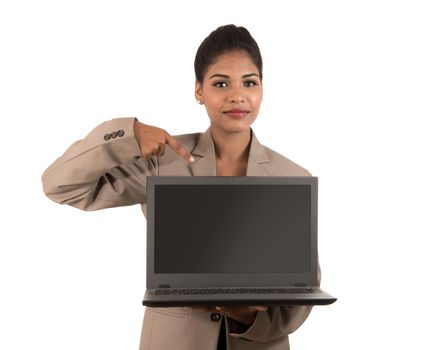 Happy excited business woman holding laptop and pointing on it isolated on a white background