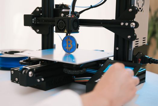 New generation of 3D printing machines printing a plastic part. For use in small spaces, offices or private use.