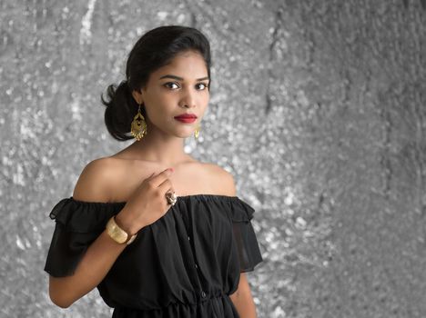 Portrait of beautiful young Girl. Closeup face of a pretty Indian model on texture background