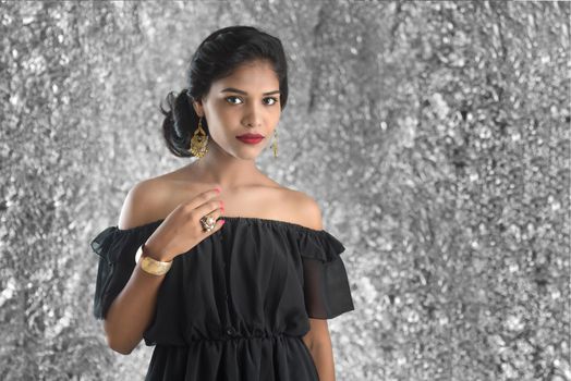 Portrait of beautiful young Girl. Closeup face of a pretty Indian model on texture background