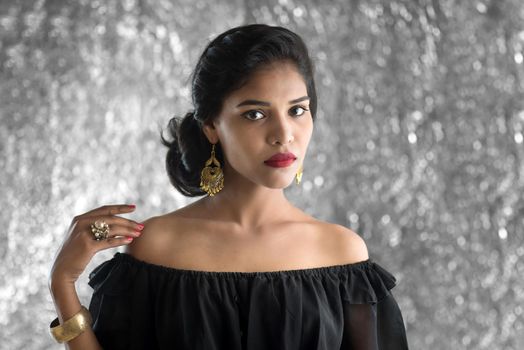 Portrait of beautiful young Girl. Closeup face of a pretty Indian model on texture background