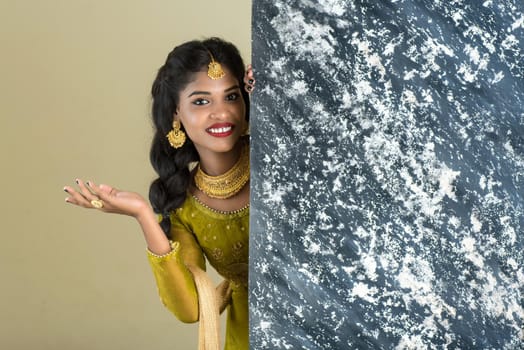 Traditional Girl holding and showing textured board