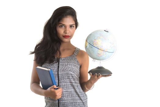Young girl student holding book with globe on white background. Education in high school university college concept