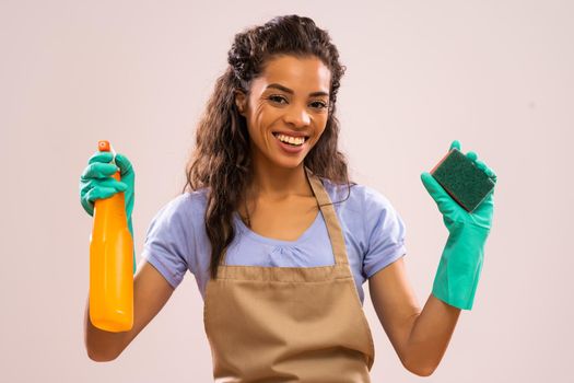 Portrait of happy and successful african-american housewife who is ready for housework.