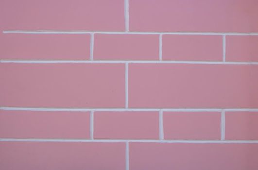 Pastel pink and white background texture of a plastered painted wall.