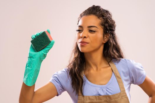 Portrait of african-american housewife who is obsessed with cleaning.