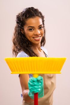 Portrait of happy and successful african-american professional maid.
