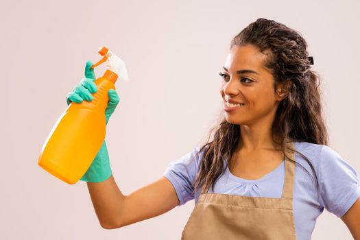 Portrait of happy and successful african-american housewife who is ready for housework.