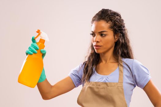 Portrait of african-american housewife who doesn't like cleaning.
