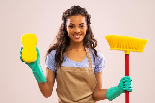Portrait of happy and successful african-american professional maid.