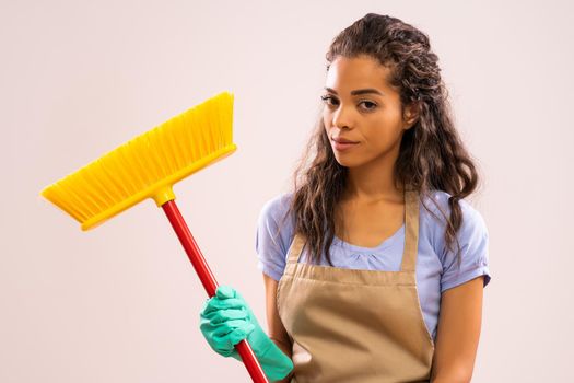 Portrait of african-american housewife who doesn't like cleaning.