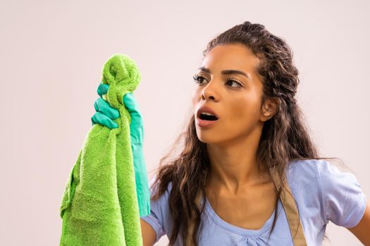 Portrait of african-american housewife who is obsessed with cleaning.