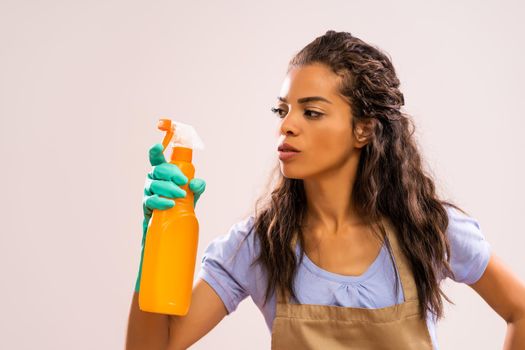 Portrait of african-american housewife who is obsessed with cleaning.