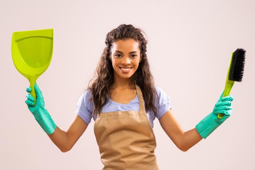 Portrait of happy and successful african-american professional maid.