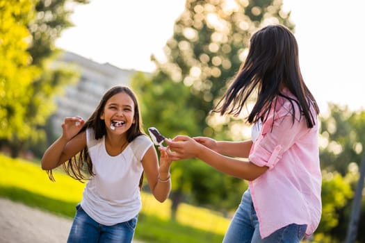 Happy family having nice time in park together.