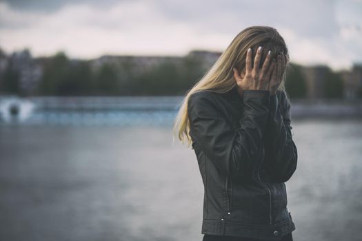 Lonely and depressed woman sitting in grief.