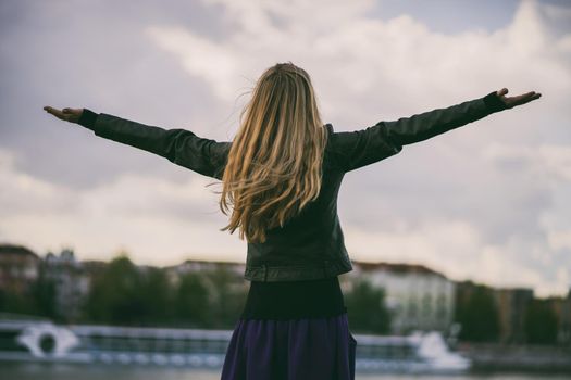 Woman enjoying fresh air after rain.