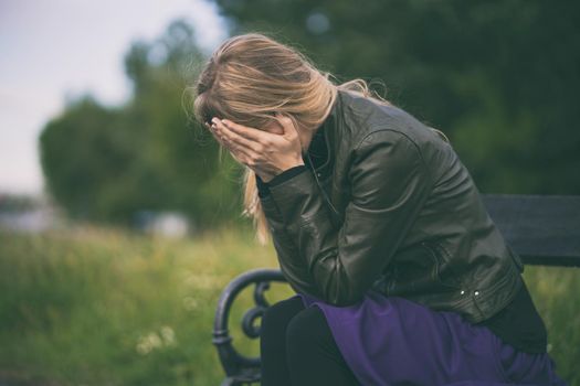 Portrait of lonely and depressed woman in grief.