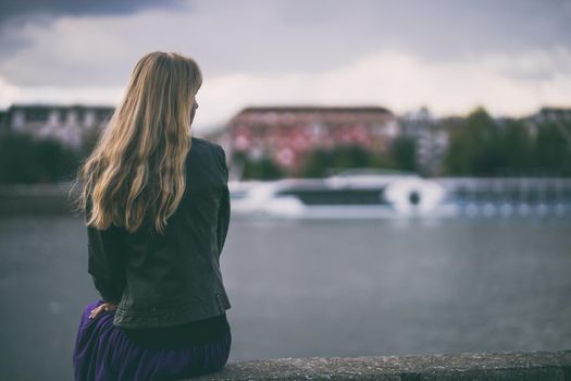 Portrait of lonely and pensive woman who is looking at distance.