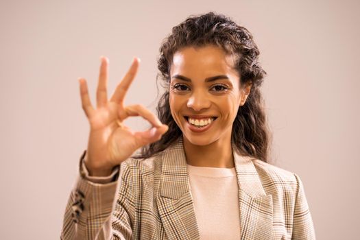 Studio shot portrait of beautiful happy african-american ethnicity businesswoman.