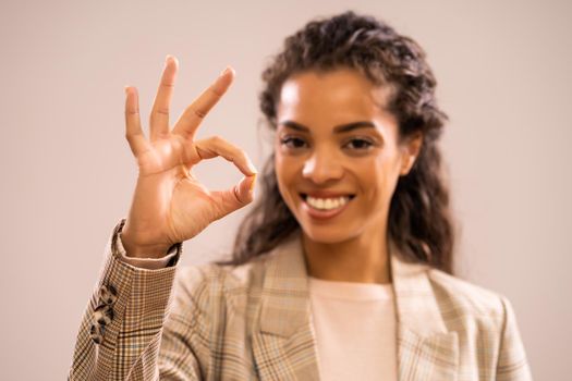 Studio shot portrait of beautiful happy african-american ethnicity businesswoman.