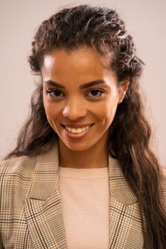 Studio shot close-up portrait of beautiful happy african-american ethnicity businesswoman.