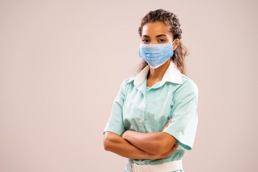 Portrait of young nurse with protective mask.
