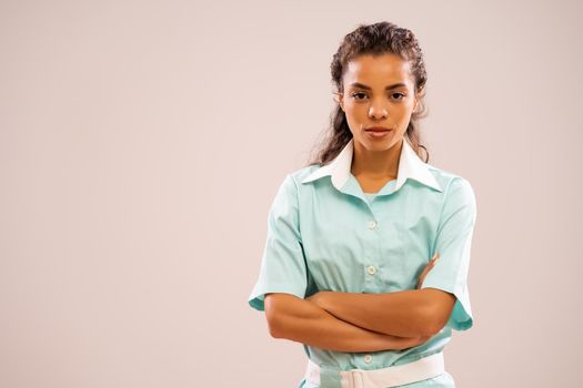 Portrait of pensive nurse who is looking at camera.