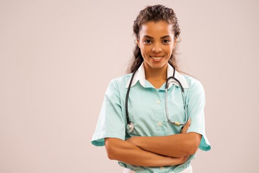 Portrait of young happy nurse who is looking at camera and smiling.