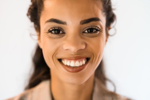 Portrait of beautiful african american woman looking at camera and smiling.