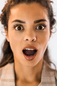 Portrait of beautiful african american woman who is surprised.