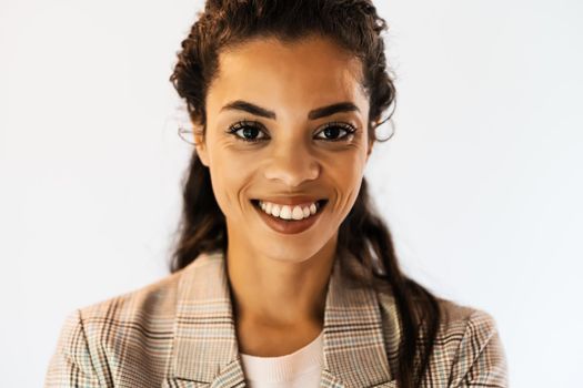 Portrait of beautiful african american woman looking at camera and smiling.