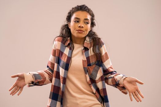 Studio shot portrait of beautiful african-american ethnicity woman who doesn't know.