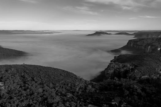 Aerial view of fog in Megalong Valley near Blackheath in The Blue Mountains in regional New South Wales in Australia
