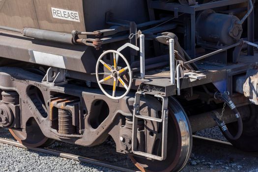 Train wheels and tank on a freight train in a production facility loading bay